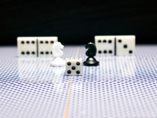 Chess pieces, dice, and dominoes