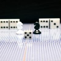 Chess pieces, dice, and dominoes