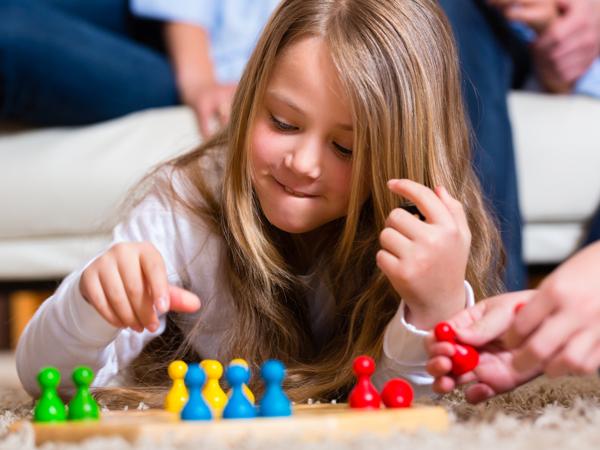 Family playing Ludo