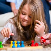 Family playing Ludo