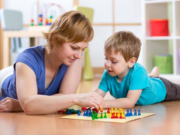 Mother and son playing Ludo