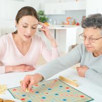 Elderly woman playing Scrabble