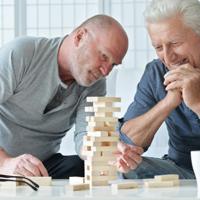 Two men playing Jenga