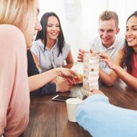 Friends playing board game