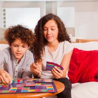 Two children playing a board game