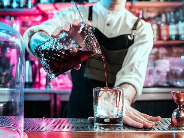 Bartender making a flaming cocktail