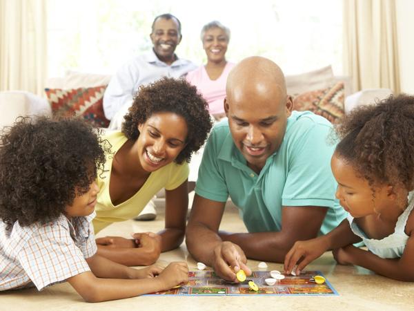 Family playing board game