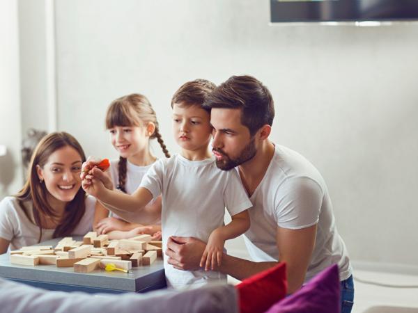 Happy family playing board games