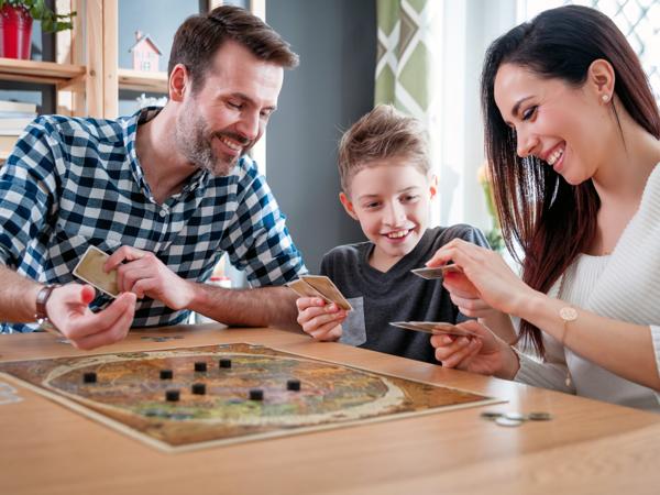 Happy family playing board games