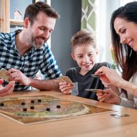 Happy family playing board games