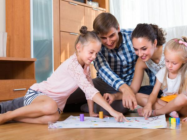 Family playing board game