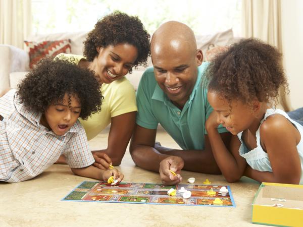 African American family playing board games