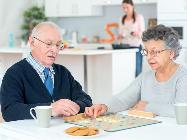 Senior couple playing Scrabble